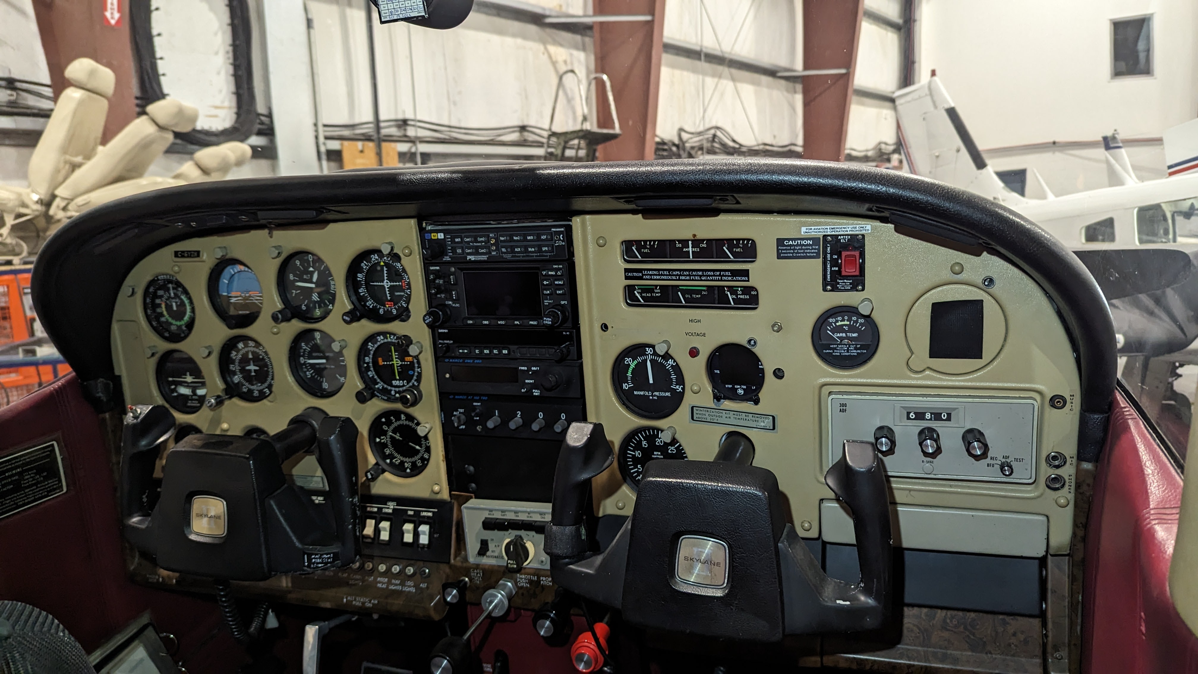 Aircraft cockpit before avionics upgrade — traditional analog steam gauges